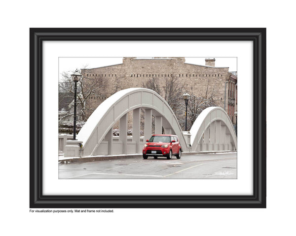 'Cambridge Soul' Photograph of Main Street Bridge in Galt, Cambridge in the winter with a red kia driving over the bridge photograph by Cambridge photographer Laura Cook 