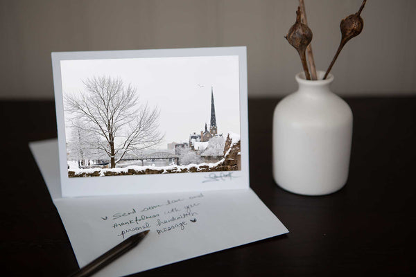 Greeting card featuring photo of millrace park in the winter in the background central presbyterian church. Photo by Cambridge Ontario Photographer Laura Cook of Vision Photography