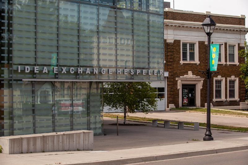 Picture of Old meeting new the new idea exchange in hespeler cambridge with Hespeler Heritage Centre and Fire Department in the background photo by Laura cook Vision Photography