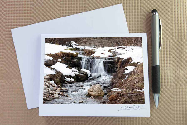 Christmas card pack of wintery scenes by Laura Cook / Vision Photography features a photo of a small waterfall blanketed by snow